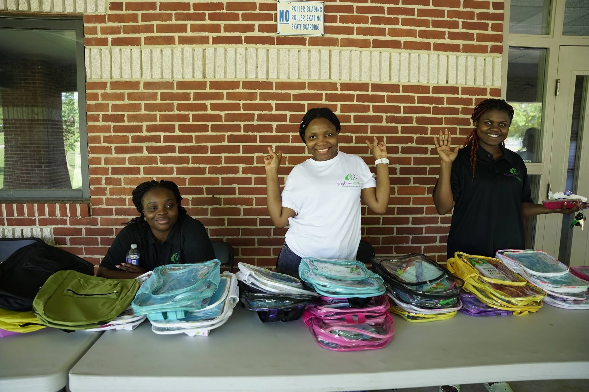 Children and families gathered with backpacks and supplies at community bash
